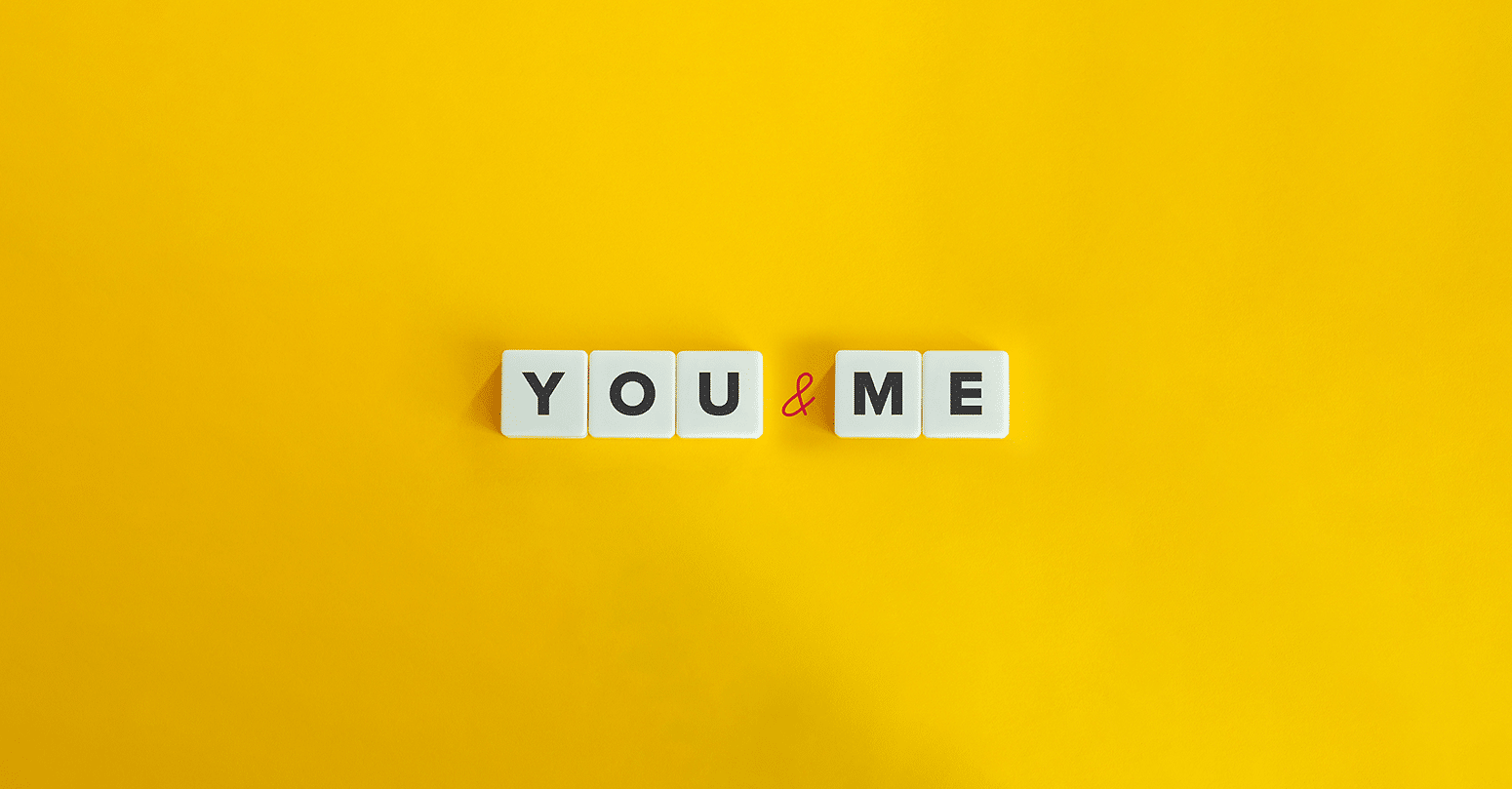 The words "you" and "me" in a yellow background.