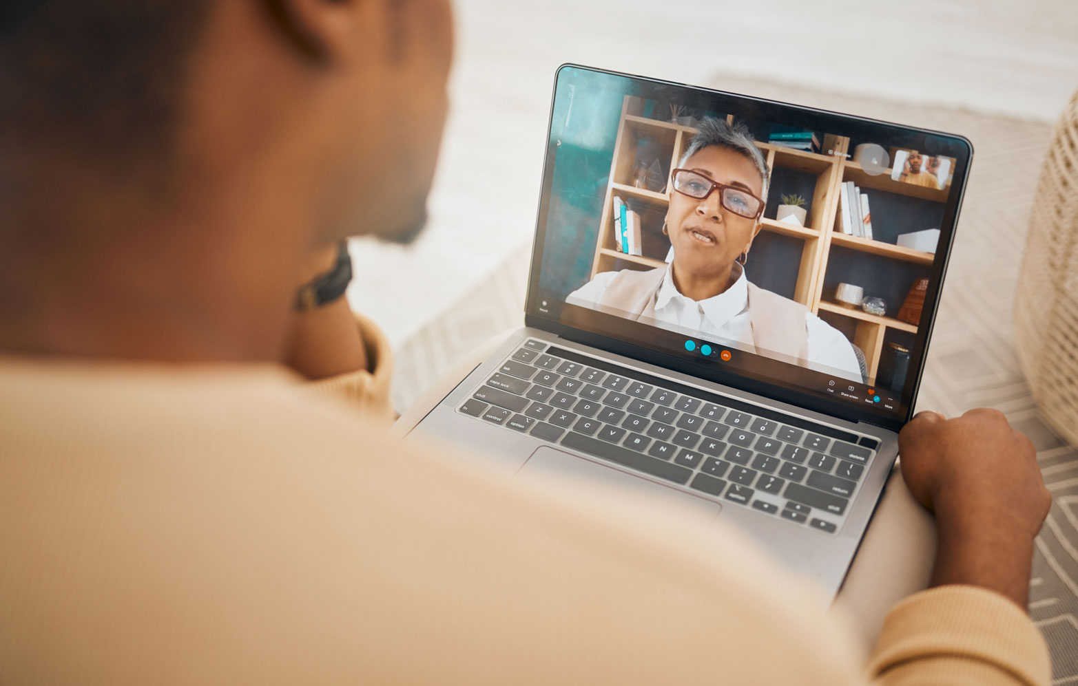 Man on a telehealth online therapy session.